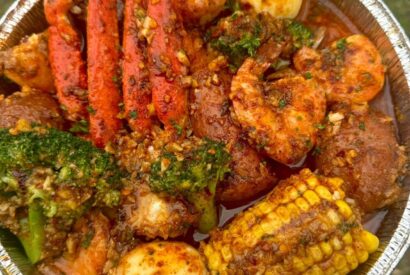 Thumbnail for Crab and Shrimp Boil with Broccoli and Spicy Sausag